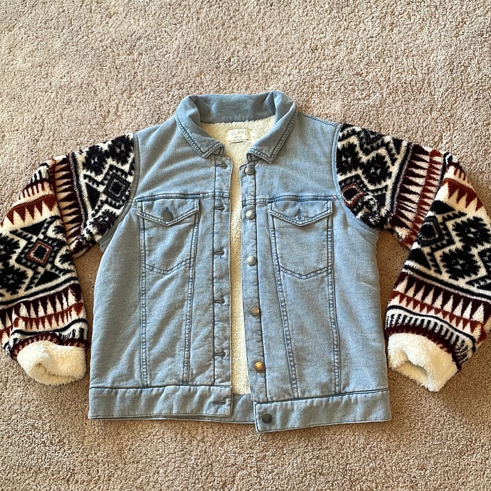 Jean jacket with Aztec sleeves.
